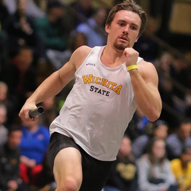 Coach Tyler Knight sprinting down the runway
